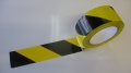 Photo of Yellow and Black Sticky Hazard Tape